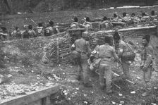 Sur le front Roumain; brancardiers emportant un blesse 1916. Creator: Unknown