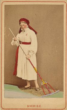 Sverige. woman raking hay, about 1867. Creator: W.A. Eurenius & P.L. Quist