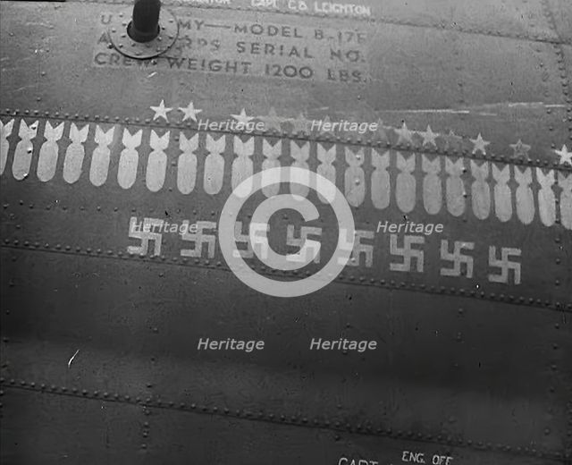 Swastika and Bomb Images Painted on the Fuselage of a Bomber Aircraft, 1943-1944. Creator: British Pathe Ltd.