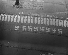 Swastika and Bomb Images Painted on the Fuselage of a Bomber Aircraft, 1943-1944. Creator: British Pathe Ltd