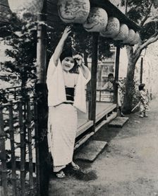 Sweet natured smile of tea-house maid, called nesan - elder sister c1900, (1921). Artist: Julian Leonard Street