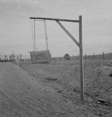 Swinging mail boxes in country where snow is deep in winter, Boundary County, Idaho, 1939. Creator: Dorothea Lange