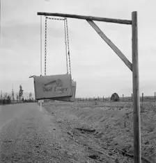 Swinging mail boxes in country where snow is deep in winter, Boundary County, Idaho, 1939. Creator: Dorothea Lange