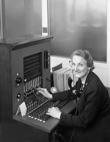Switch board operator, Spillers Animal Foods, Gainsborough, Lincolnshire, 1960. Creator: Michael Walters