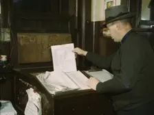 Switch lists coming in by teletype to the hump office at a C& NW RR yard, Chicago, Ill., 1942. Creator: Jack Delano