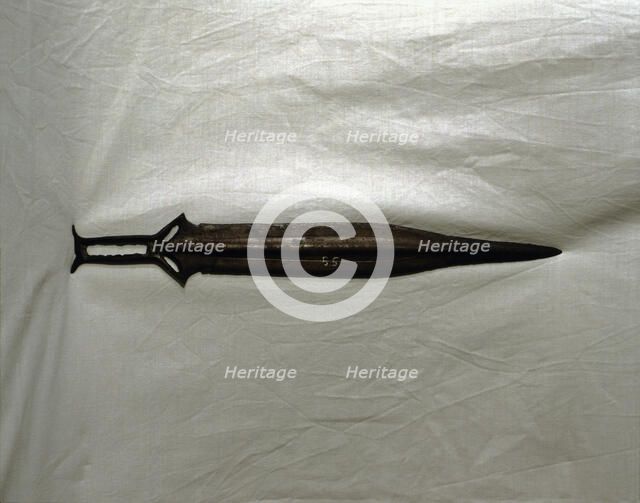 Sword of three parts barb, carp's tongue shaped blade, from Palma del Rio (Cordoba).