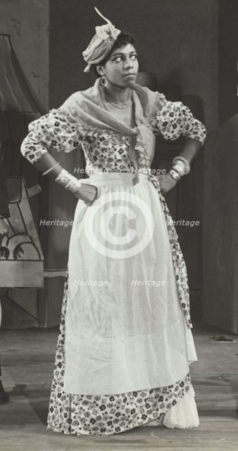 Sybil Moore portraying a typical West Indian character, 1937. Creator: Unknown.