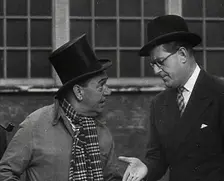 Syd Walker Talking to Stanley Holloway About Using gramophone records for War Materials, 1942. Creator: British Pathe Ltd