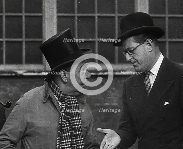 Syd Walker Talking to Stanley Holloway About Using gramophone records for War Materials, 1942. Creator: British Pathe Ltd.