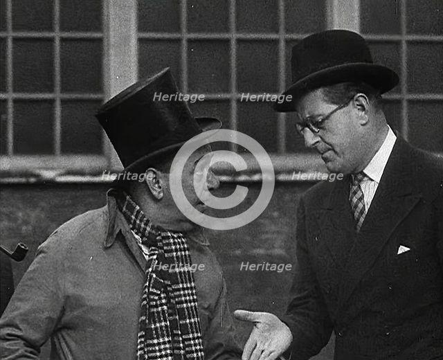 Syd Walker Talking to Stanley Holloway About Using gramophone records for War Materials, 1942. Creator: British Pathe Ltd.
