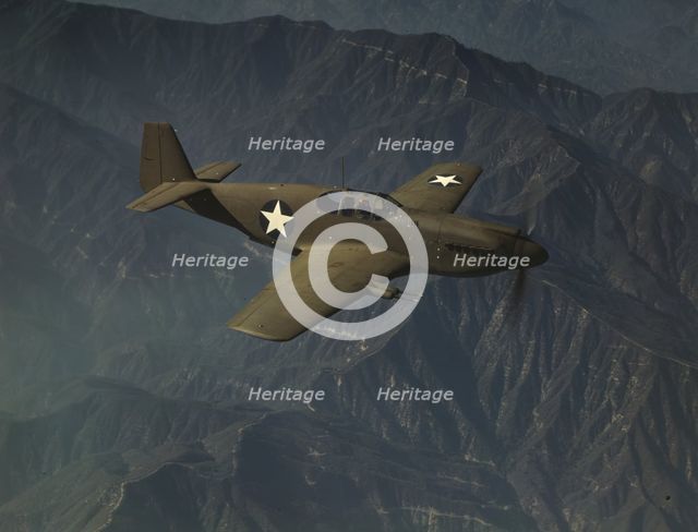 P-51 "Mustang" fighter in flight, Inglewood, Calif. , 1942. Creator: Alfred T Palmer.