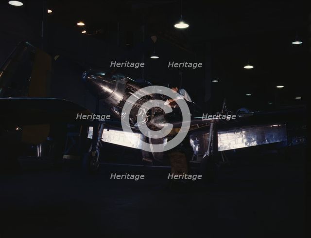 P-51 ("Mustang") fighter plane in construction, North American Aviation, Inc., LA, Calif. , (1942?). Creator: Alfred T Palmer.