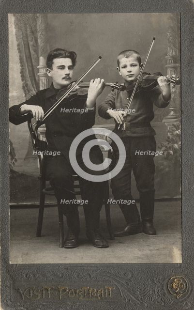 P.L. Stolyarov and V.P. Karetnikov playing violins, 1910-1919. Creator: I. F. Varlekhovskii.