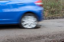 Pot holes in road surface 2017. Creator: Unknown