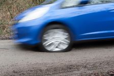 Pot holes in road surface 2017. Creator: Unknown