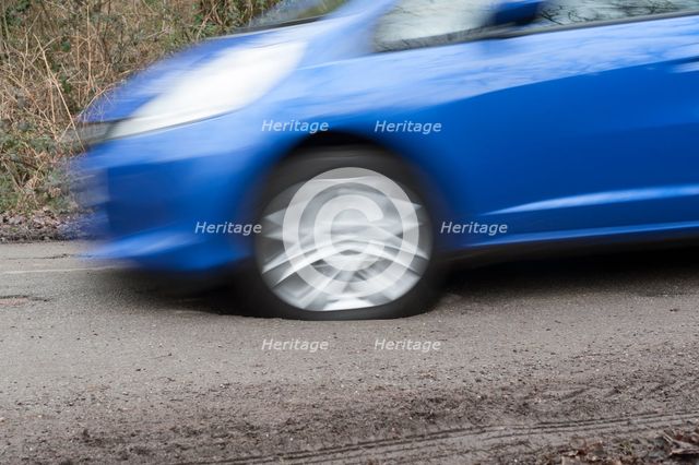 Pot holes in road surface 2017. Creator: Unknown.