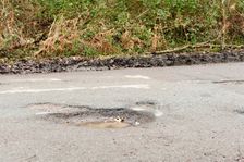 Pot holes in road surface 2017. Creator: Unknown