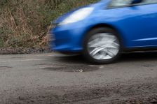 Pot holes in road surface 2017. Creator: Unknown