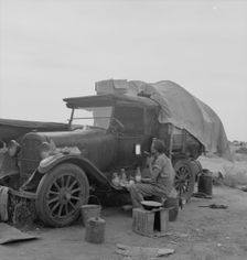 Potato picker in camp near Shafter, California, 1937. Creator: Dorothea Lange