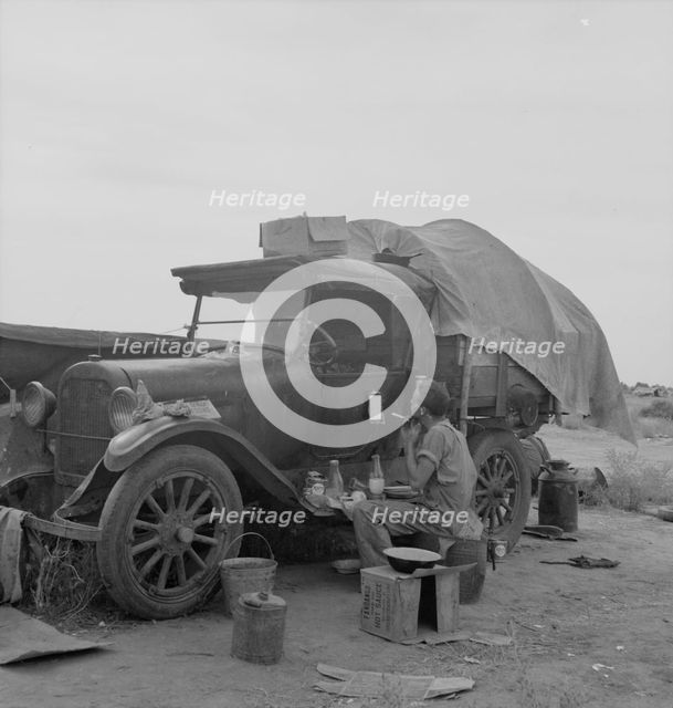 Potato picker in camp near Shafter, California, 1937. Creator: Dorothea Lange.