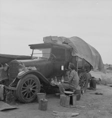 Potato picker in camp near Shafter, California, 1937. Creator: Dorothea Lange