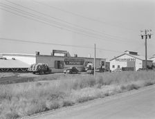 Potato sheds during season, across the road from the..., Tulelake, Siskiyou County, California, 1939 Creator: Dorothea Lange