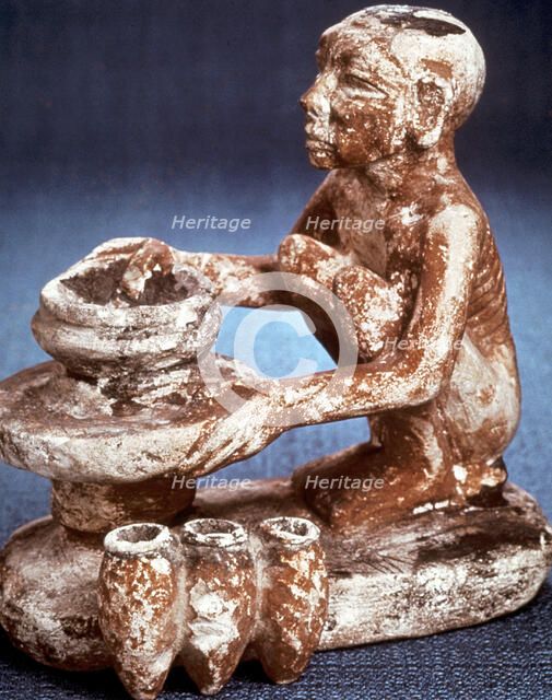 Potter turning vessels on a wheel, Ancient Egyptian, Old Kingdom, 5th Dynasty (2565-2420 BC). Artist: Unknown