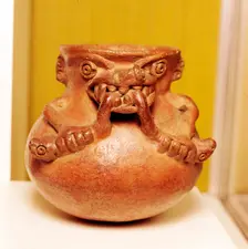 Pottery Bowl of an alligator with human arms devouring snakes, Chiriqui, Panama