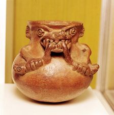 Pottery Bowl of an alligator with human arms devouring snakes, Chiriqui, Panama
