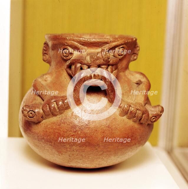 Pottery Bowl of an alligator with human arms devouring snakes, Chiriqui, Panama. Artist: Unknown.