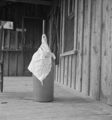 Pottery butter churn on porch of Negro tenant..., Randolph County, North Carolina, 1939. Creator: Dorothea Lange