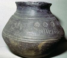 Pottery cremation urn, from a grave at Loveden Hill, Lincolnshire, Anglo-Saxon, 6th-7th century