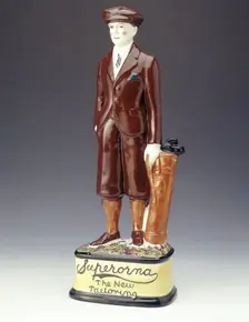 Pottery figure of a golfer advertising Superorna tailoring, 1920s. Creator: Unknown