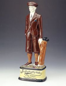 Pottery figure of a golfer advertising Superorna tailoring, 1920s. Creator: Unknown
