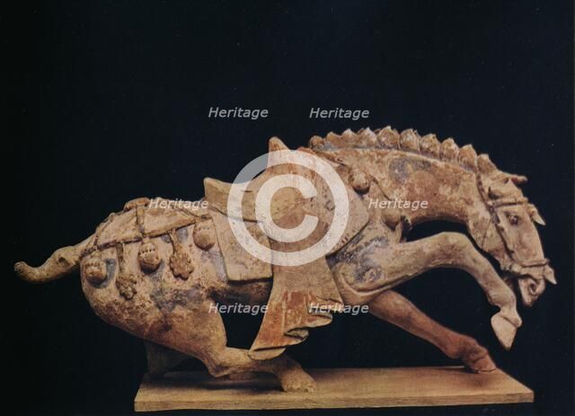 'Pottery Figure of a Horse - T'Ang Dynasty', c7th to 10th century AD, (1936). Artist: Unknown.
