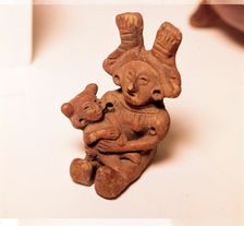 Pottery Rattle of woman holding child, Mexico. Axtec, late Post-Classic Period, 1300-1520