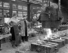 Pouring a small casting at Edgar Allen's Steel foundry, Sheffield, South Yorkshire, 1963. Creator: Michael Walters