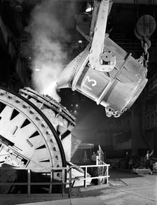 Pouring iron into a Kaldo unit, Park Gate Iron and Steel Co, Rotherham, South Yorkshire, 1964. Creator: Michael Walters