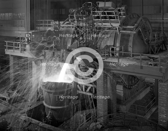 Pouring molten iron, Park Gate steelworks, Rotherham, South Yorkshire, 1964. Creator: Michael Walters.