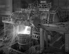 Pouring molten iron, Park Gate steelworks, Rotherham, South Yorkshire, 1964. Creator: Michael Walters