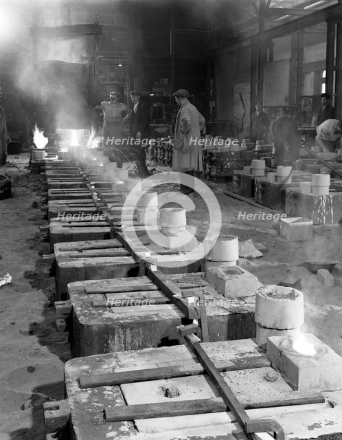 Pouring small castings, Edgar Allen Steel Co, Sheffield, South Yorkshire, 1963.  Creator: Michael Walters.