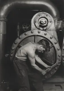 Power house mechanic working on steam pump, 1920. Creator: Lewis Wickes Hine