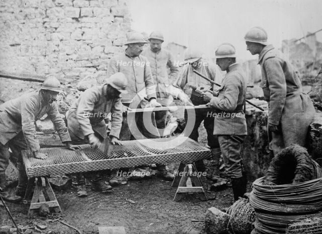 Poilus making mattresses, between c1915 and c1918. Creator: Bain News Service.