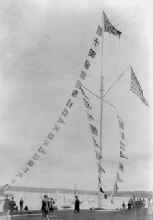 Pole with flags of different countries; sailboats in background, Oyster Bay, Long Island, N.Y., 1905 Creator: Frances Benjamin Johnston