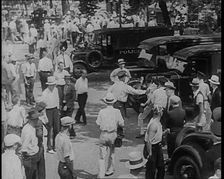 Police Officers Confronting Protesting Soldiers To Disperse the Army Veterans, 1932. Creator: British Pathe Ltd