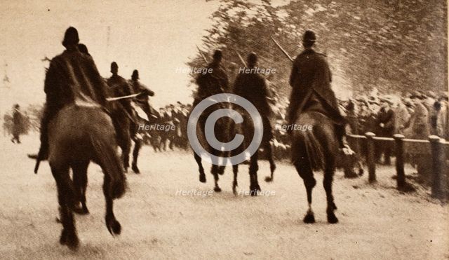 Police on Horseback controling crowds during the Great Strike at Hyde Park Corner, pub. 1926 (photog