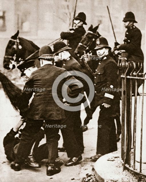 Police arresting a group of hunger marchers in London, 1932.  Creator: Unknown.