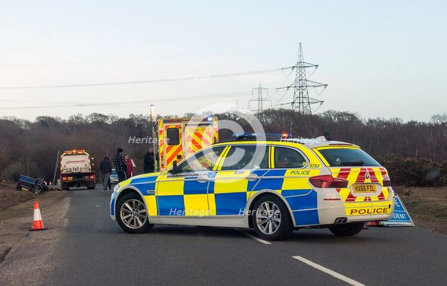 Police car and ambulance attending road traffic accident 2018. Creator: Unknown.
