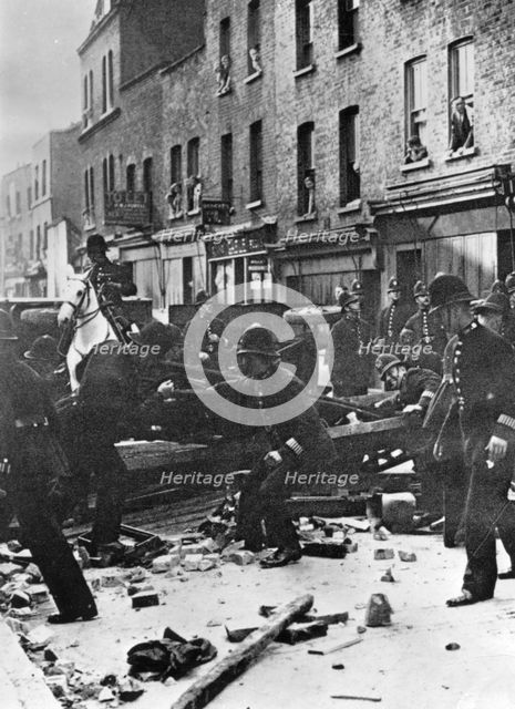 Police dismantle an anti-Fascist barricade, East London, 4th October 1936. Artist: Unknown