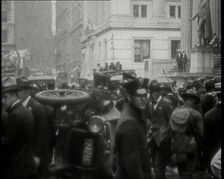 Police Looking Over Overturned Vehicles in New York City After a Bomb Was Thrown at the..., 1920. Creator: British Pathe Ltd